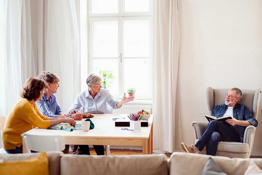 group-of-senior-people-playing-board-games-in-community-center-club-1